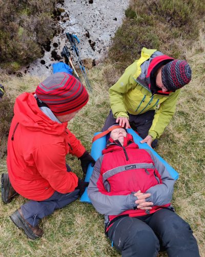 Improvising methods to optimise control of the C-spine in an unconscious casualty.